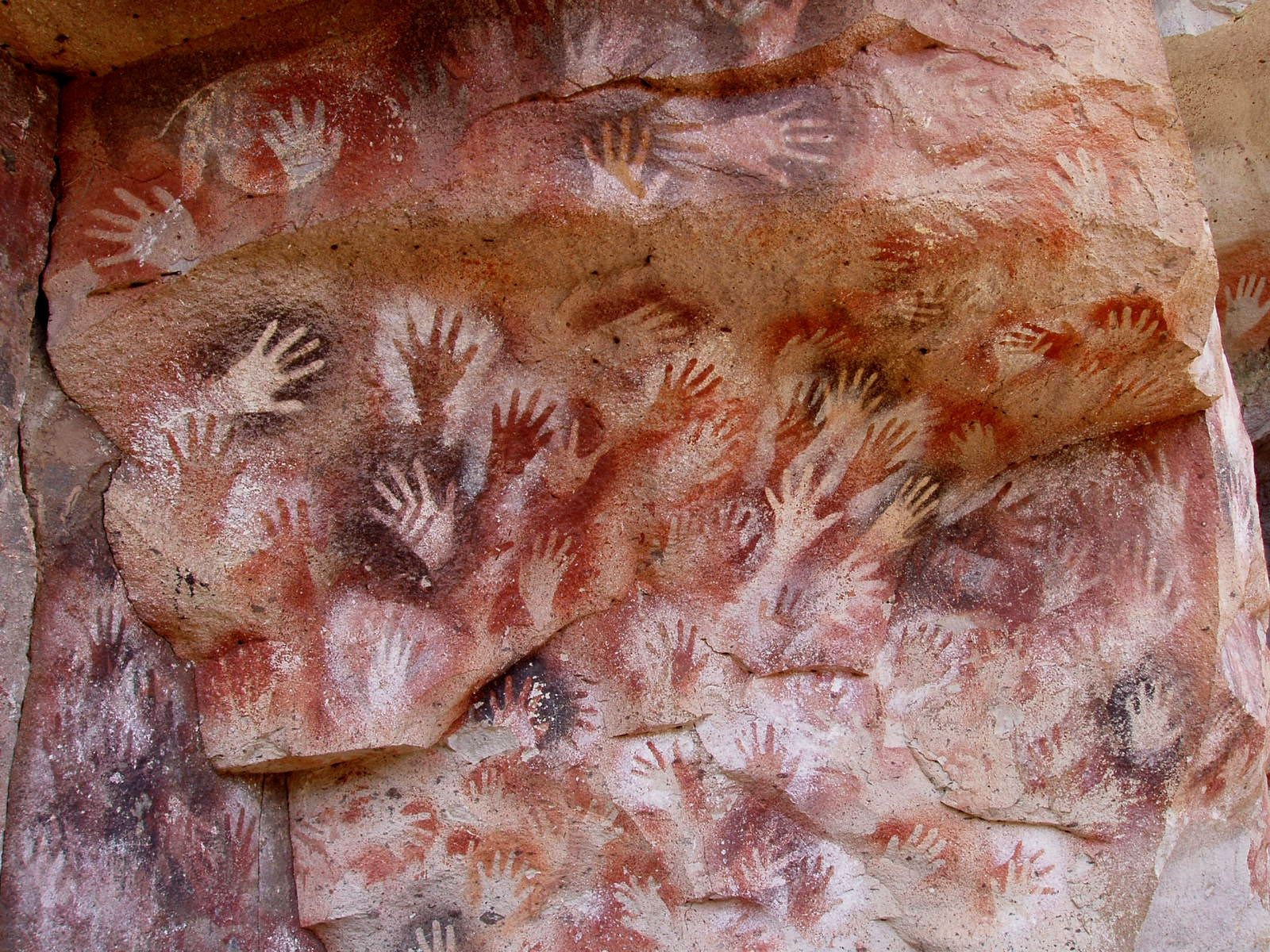 Hands stenciled on the rock of the Cueva de las Manos